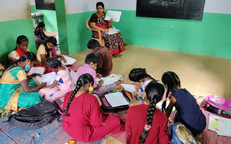 Art Instructor Mrs. Lakshmi Swamy Showing the Samples of Pictures