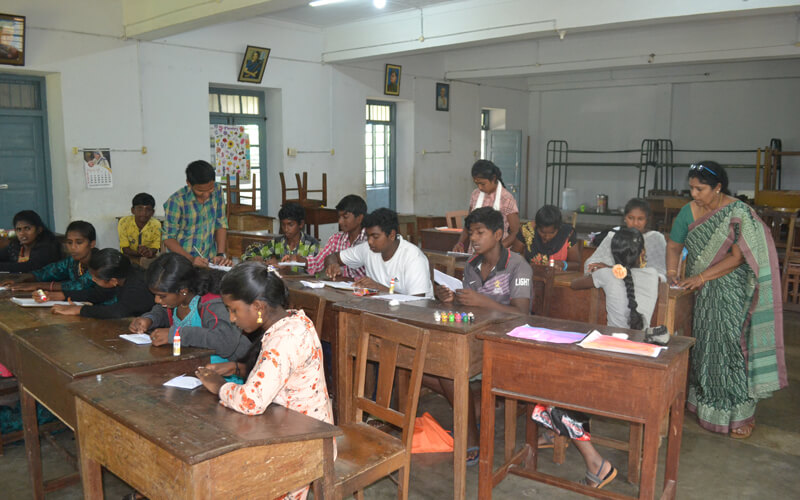 Art Instructor Mrs. Lakshmi Swamy teaching the Children