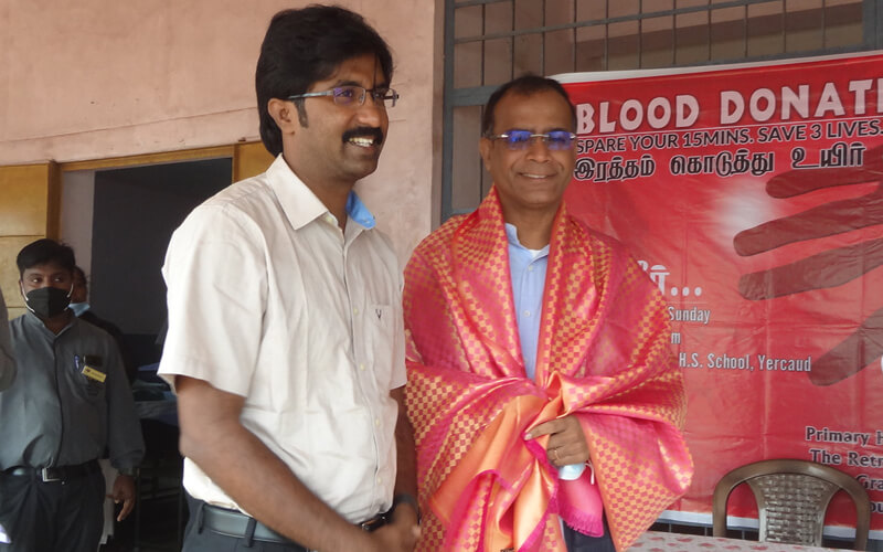 Dr. Thomson BMO, Yercaud felicitating Fr. Raj SDB