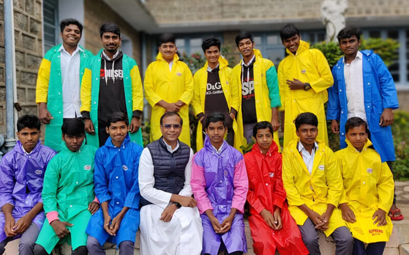 Happy Faces of SOTCHO Boys with Colorful Raincoats