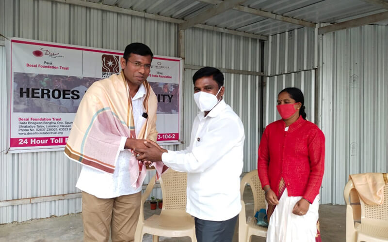 Chief Guest Felicitating Fr. Selvakumar Director of SPS INDIA Foundation