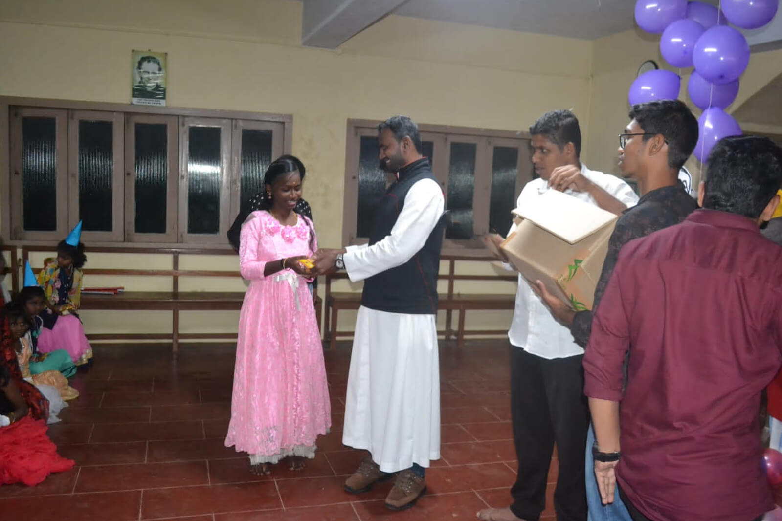 Christmas Cake Distributed to Night School Children