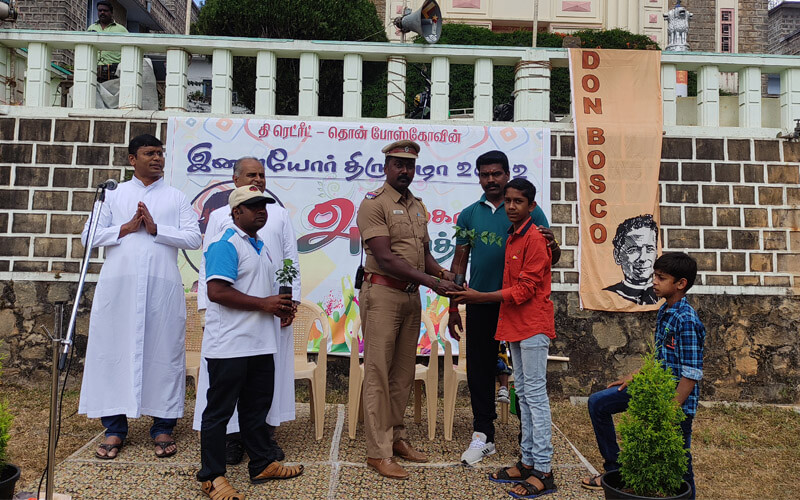 Mr. Sabapathy, Sub-Inspector, Yercaud Distributing Saplings