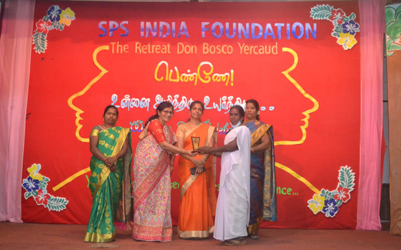 Presenting Momento To Mrs. Devi - Best Participation Award